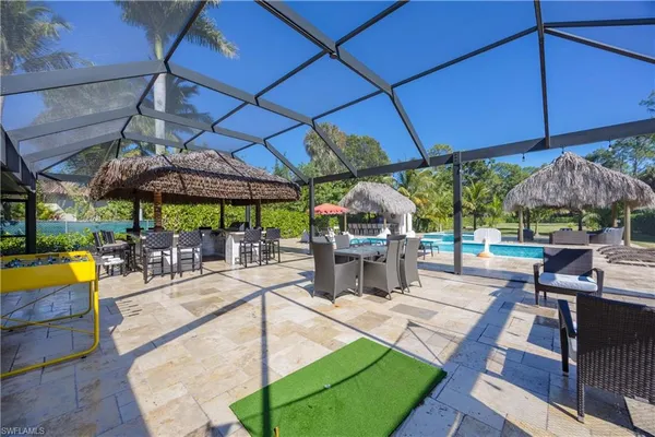 a view of swimming pool with a patio