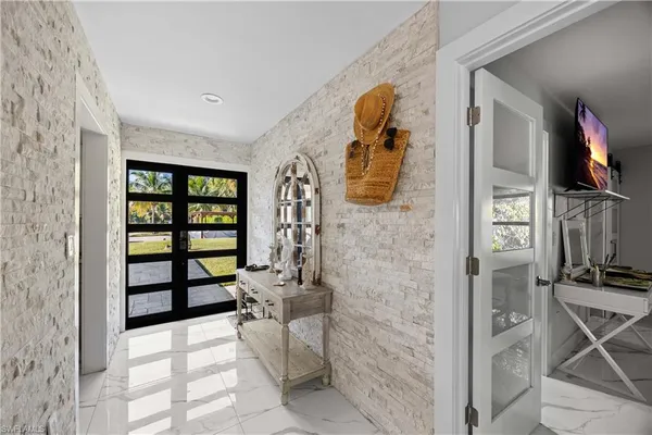 a kitchen with stainless steel appliances a stove sink and refrigerator