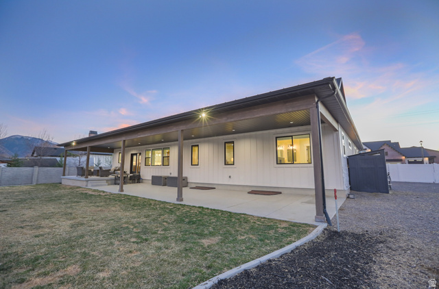 126 North 800 West Mapleton, UT 84664 - Photo 71 of 79 Back of house at dusk with a fenced backyard and a patio area