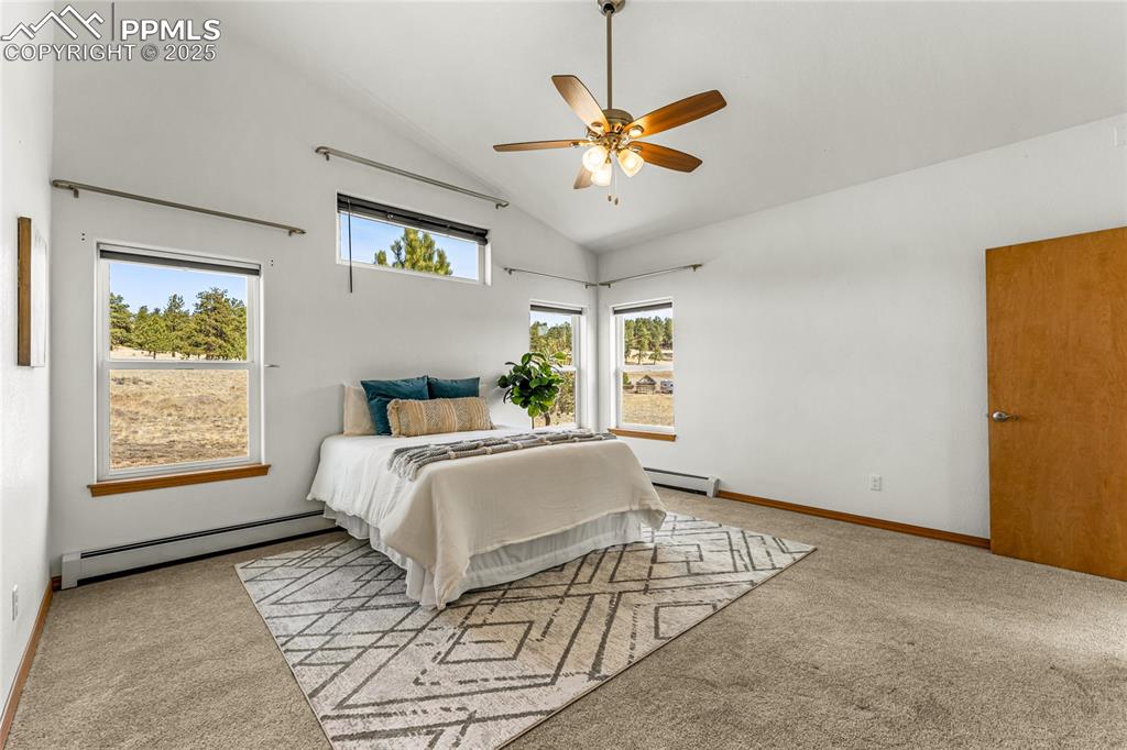 2649 Southpark Road Florissant, CO 80816 - Photo 15 of 42 a bed sitting in a spacious bedroom next to a window