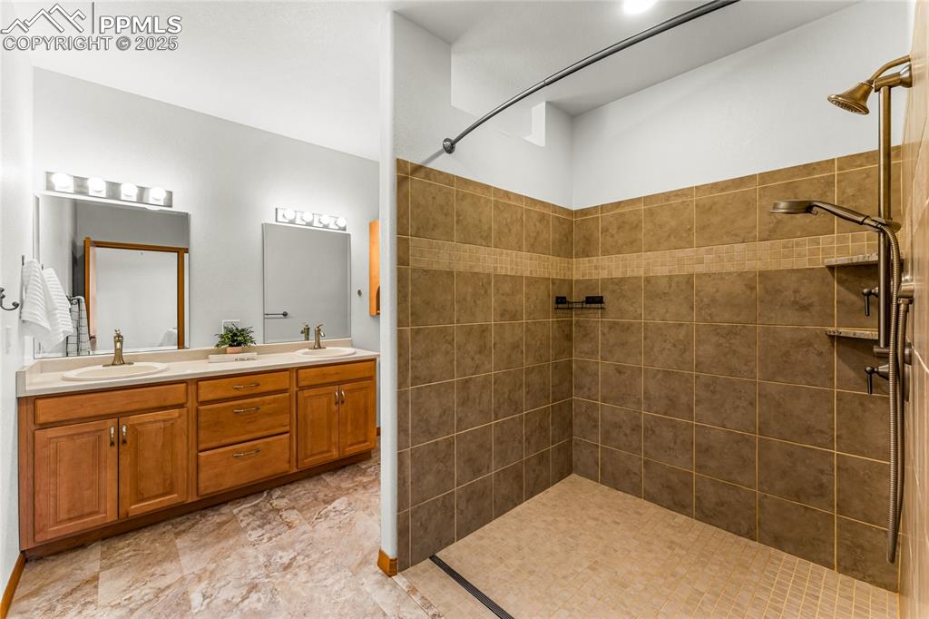 2649 Southpark Road Florissant, CO 80816 - Photo 16 of 42 a bathroom with a bathtub and a sink