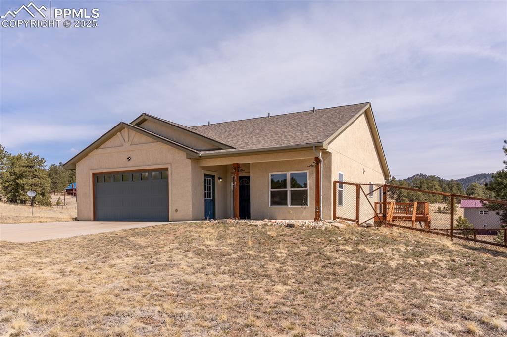 2649 Southpark Road Florissant, CO 80816 - Photo 2 of 42 a view of a house with a yard