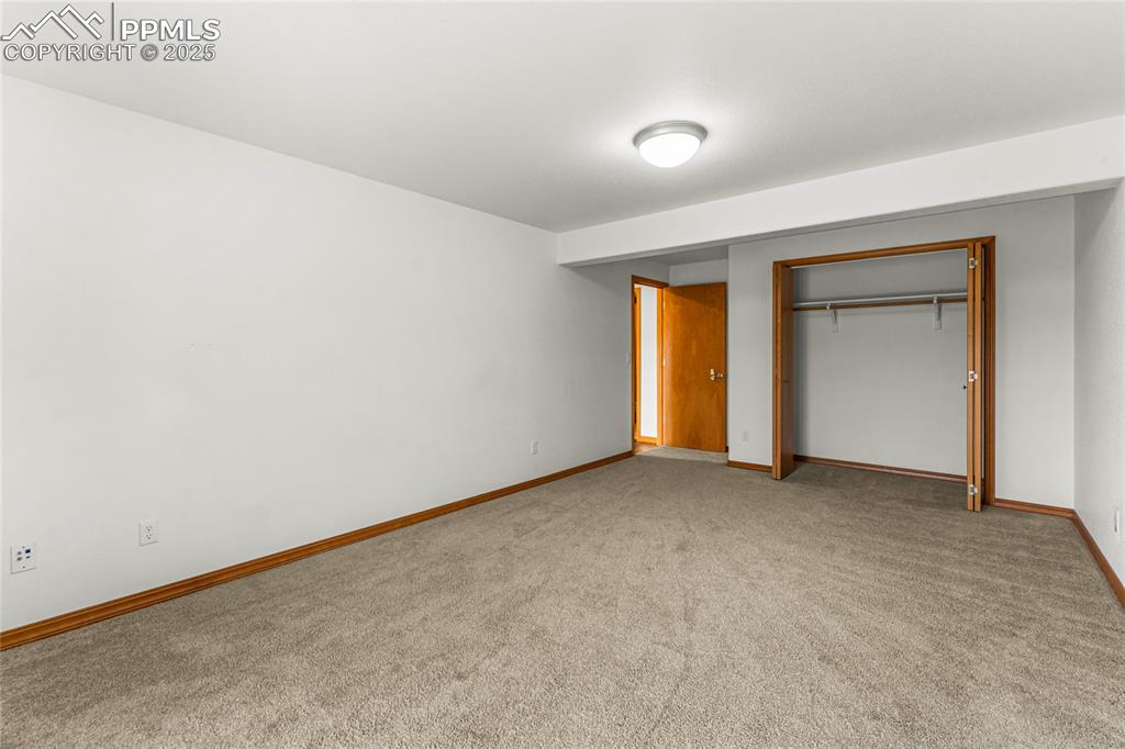 2649 Southpark Road Florissant, CO 80816 - Photo 22 of 42 an empty room with window and closet area