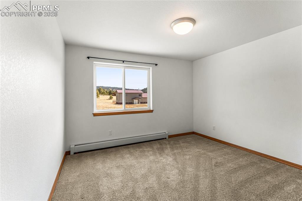 2649 Southpark Road Florissant, CO 80816 - Photo 23 of 42 an empty room with windows