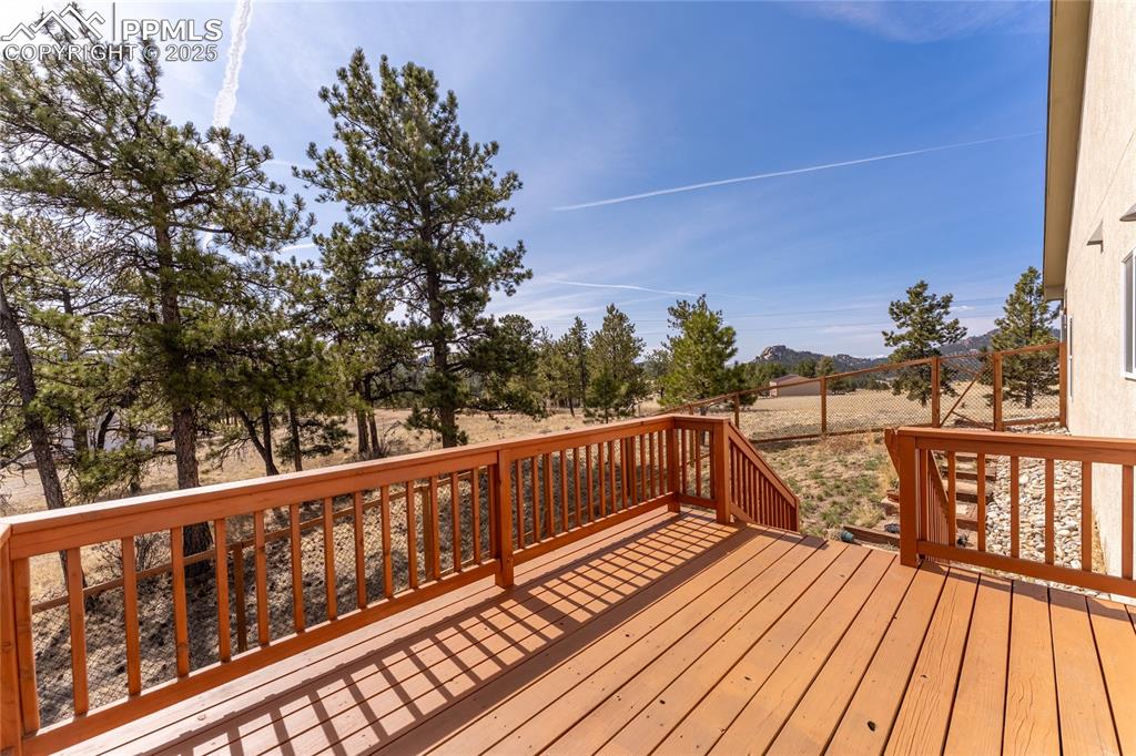 2649 Southpark Road Florissant, CO 80816 - Photo 27 of 42 a view of balcony with wooden floor and fence