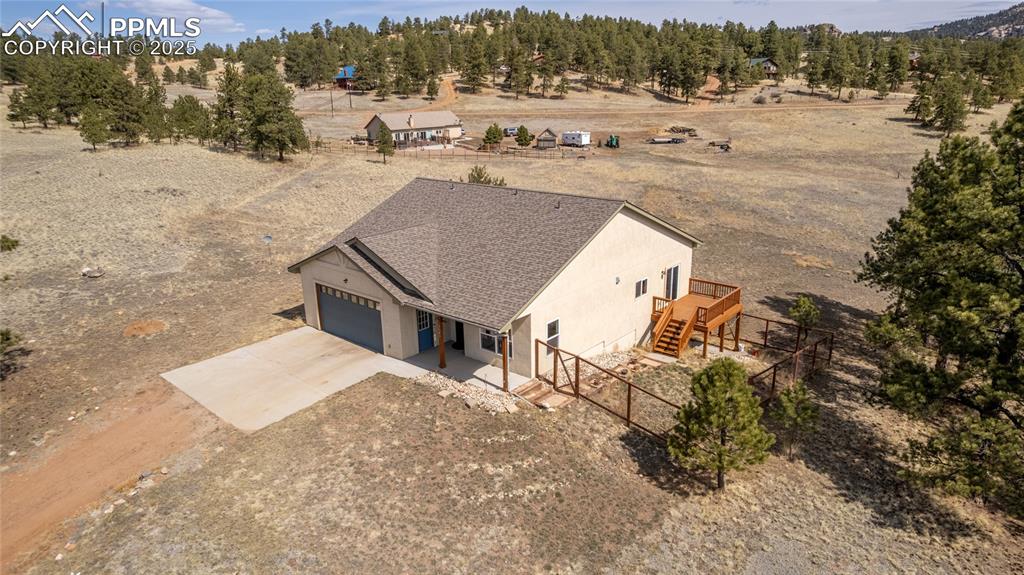 2649 Southpark Road Florissant, CO 80816 - Photo 29 of 42 a view of a house with a yard and mountain