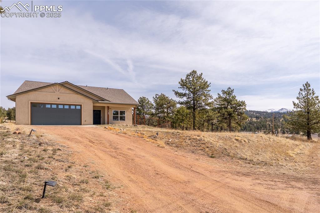 2649 Southpark Road Florissant, CO 80816 - Photo 3 of 42 a big house with a mountain in the background