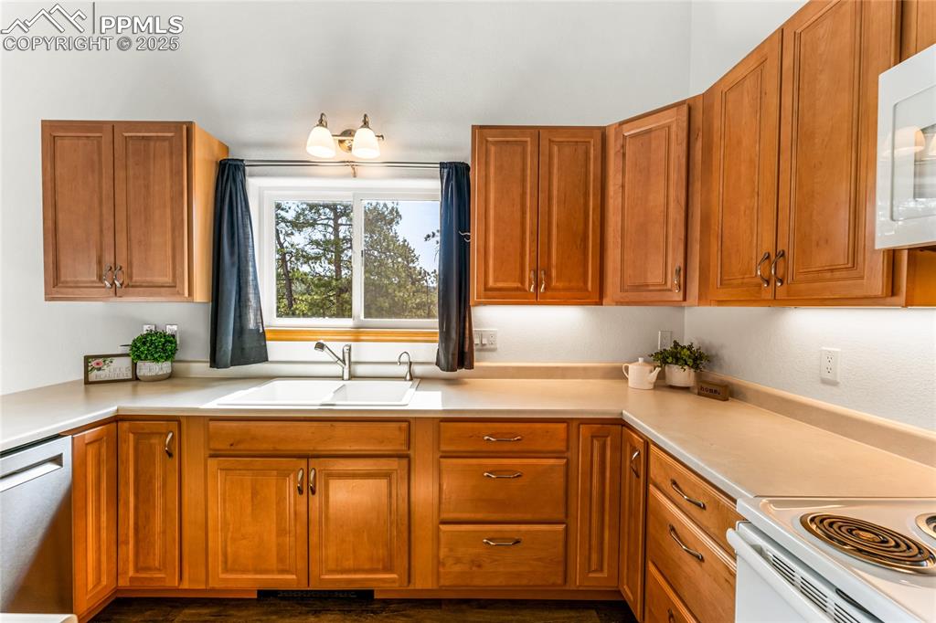 2649 Southpark Road Florissant, CO 80816 - Photo 10 of 42 a kitchen with a sink cabinets and window