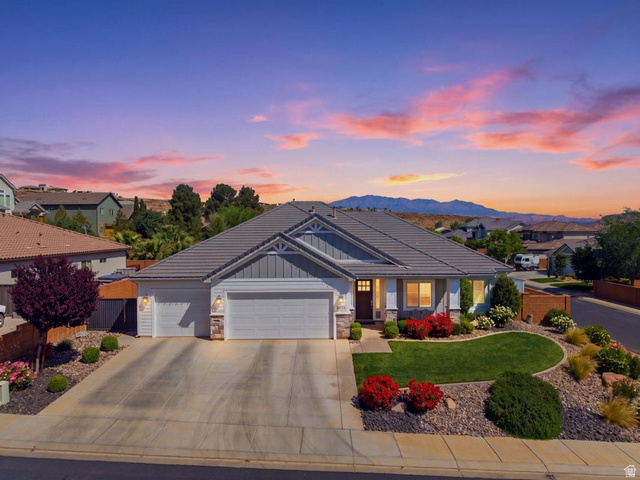 2829 East 1880th Street South St. George, UT 84790 - Photo 3 of 54 Craftsman-style home with a garage, stone siding, concrete driveway, board and batten siding, and a residential view