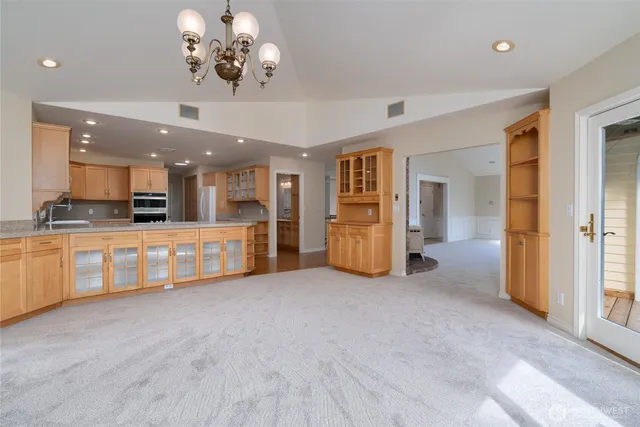 a view of a kitchen with a sink and cabinet