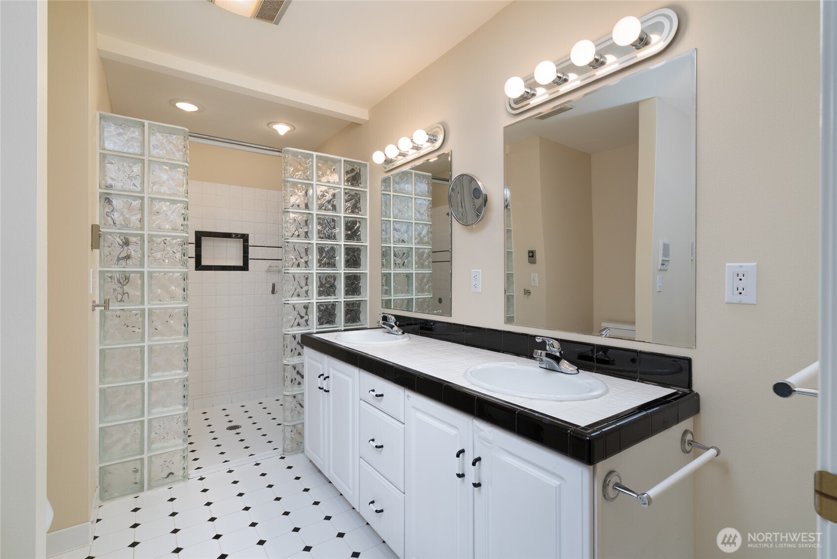 476 Nez Perce Place La Conner, WA 98257 - Photo 18 of 40 a bathroom with a sink double vanity and a mirror