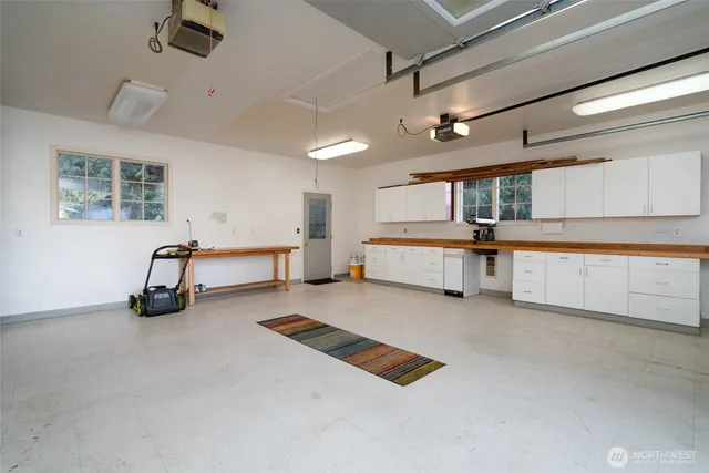 an aerial view of a house with a swimming pool