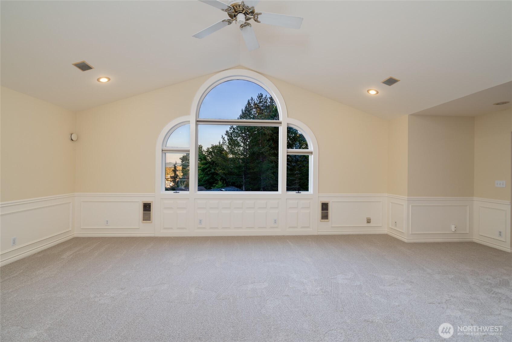 476 Nez Perce Place La Conner, WA 98257 - Photo 7 of 40 an empty room with a fireplace and windows
