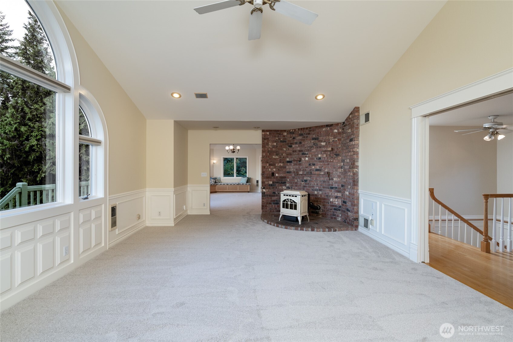476 Nez Perce Place La Conner, WA 98257 - Photo 9 of 40 a view of an empty room with fireplace and windows
