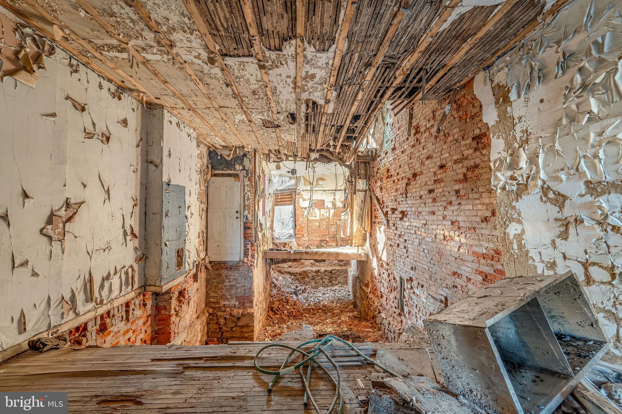 542 York Street Camden, NJ 08102 - Photo 4 of 11 a view of a brick house with a bench
