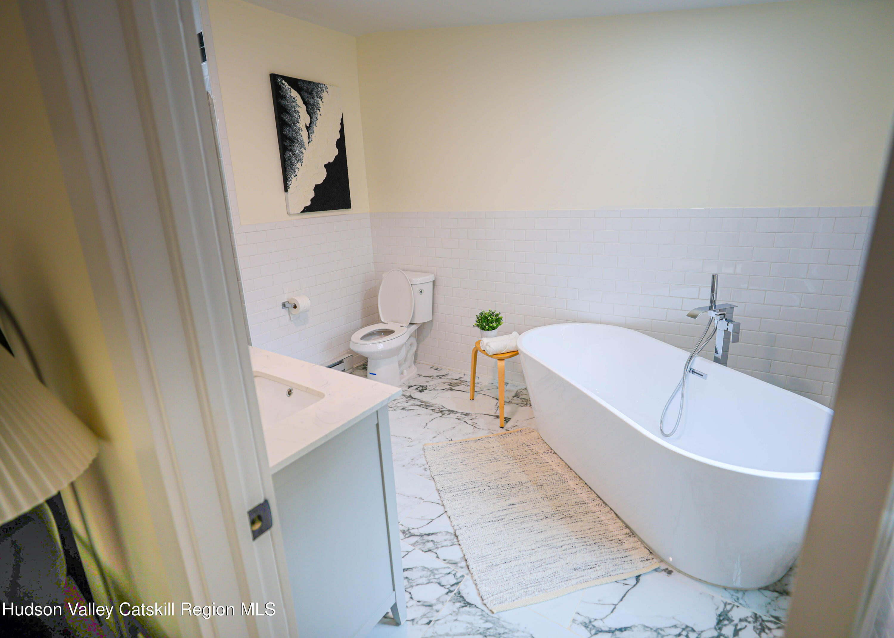 169 West Saugerties Road Saugerties, NY 12477 - Photo 26 of 43 a bathroom with a white tub a sink and vanity