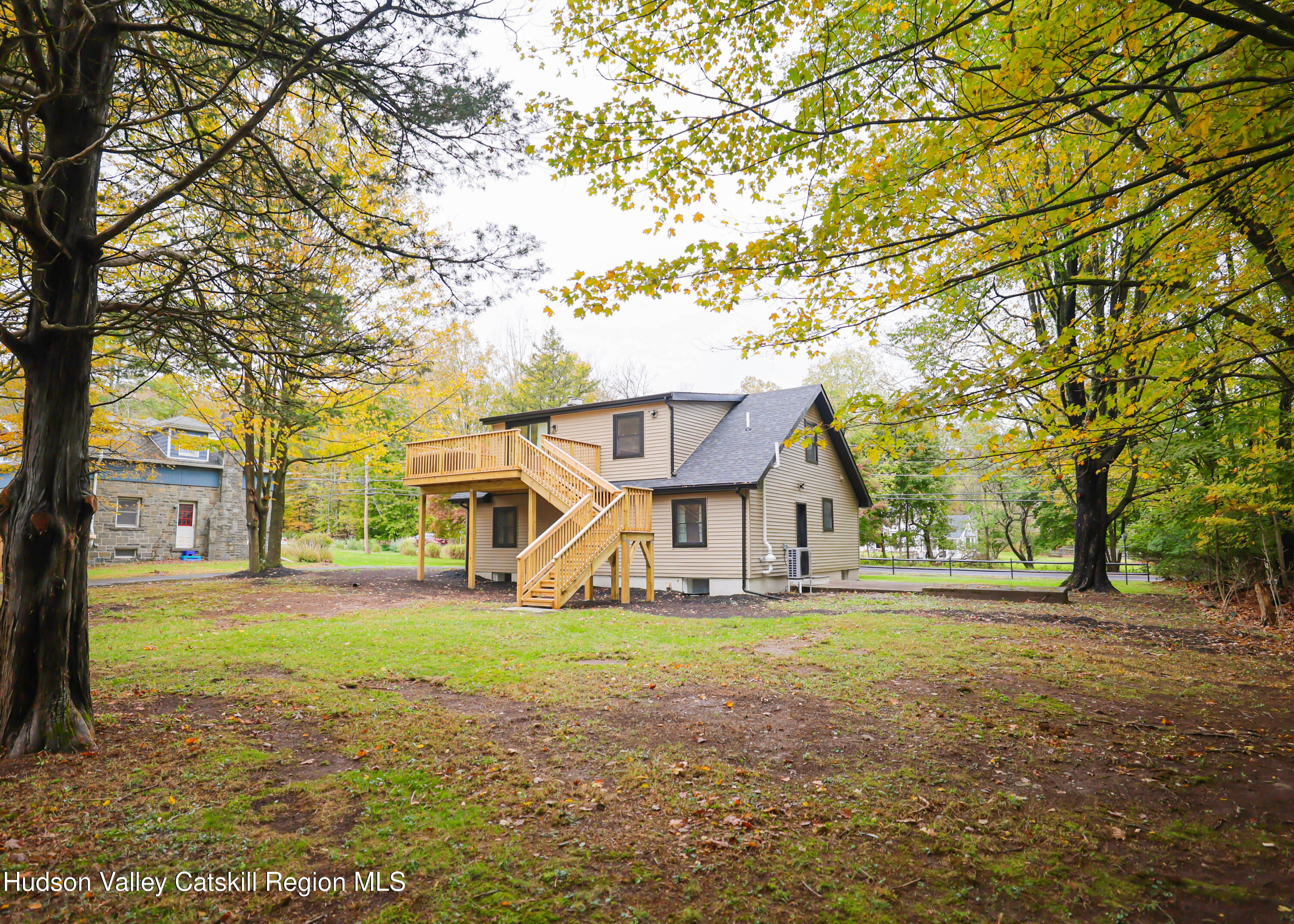 169 West Saugerties Road Saugerties, NY 12477 - Photo 38 of 43 a view of a house with a yard and large trees