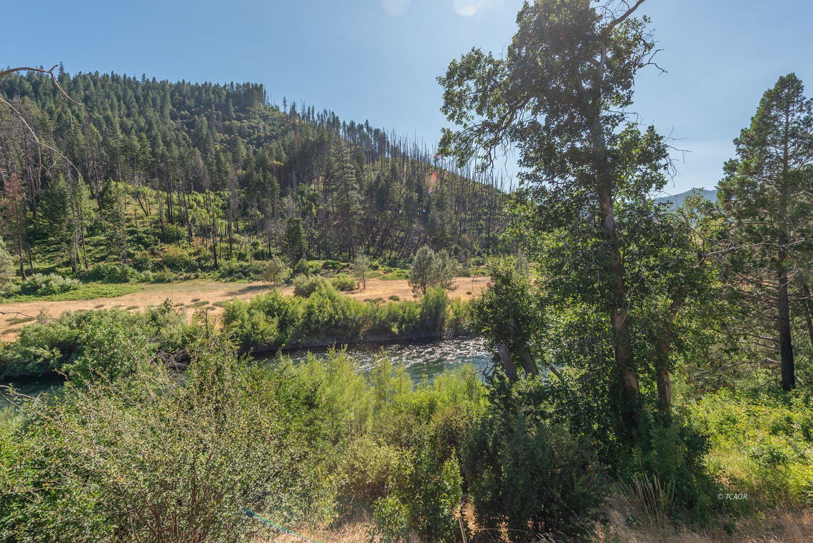 38500 Highway 299 Junction City, CA 96048 - Photo 2 of 49 a view of a lake with a mountain