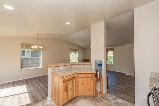 a view of living room with granite countertop furniture and fireplace
