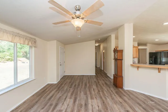 a view of a livingroom with wooden floor