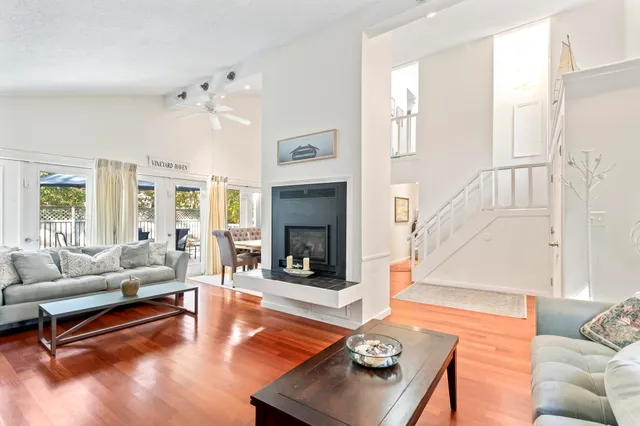 a living room with furniture fireplace and a table