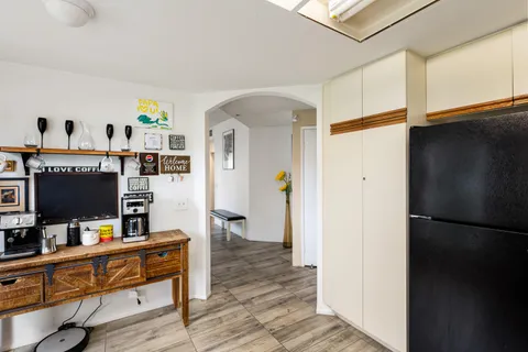 a room with furniture and a flat screen tv