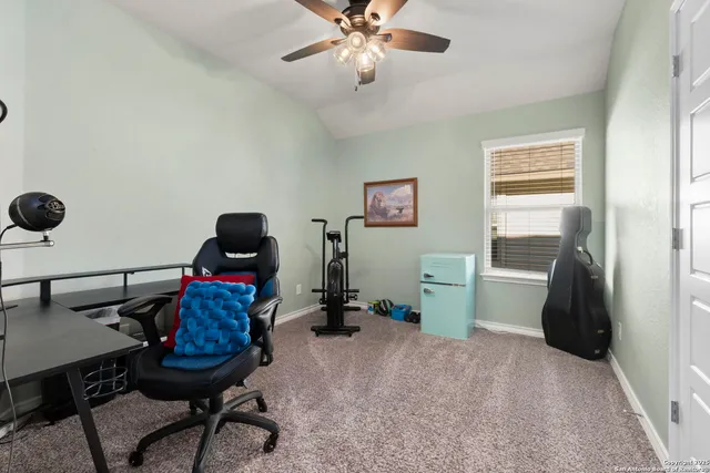 a workspace with furniture and chandelier