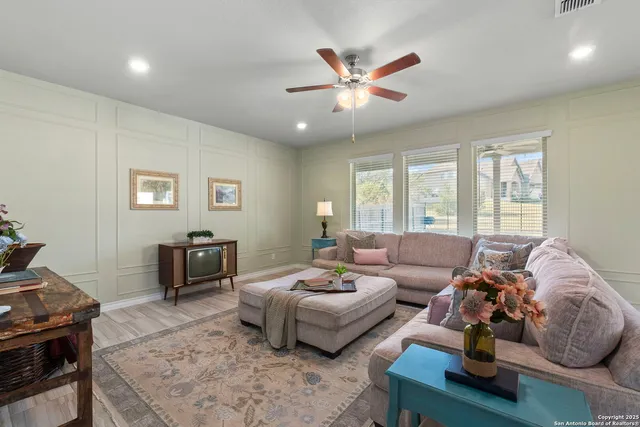 a living room with furniture and a window