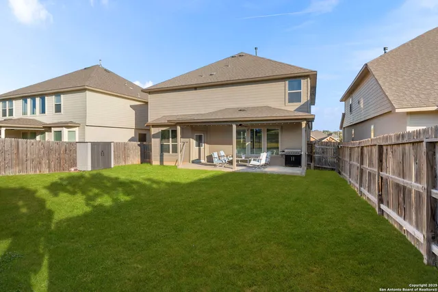 a view of a house with a yard and plants