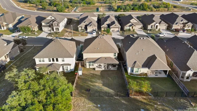 an aerial view of a house with a swimming pool