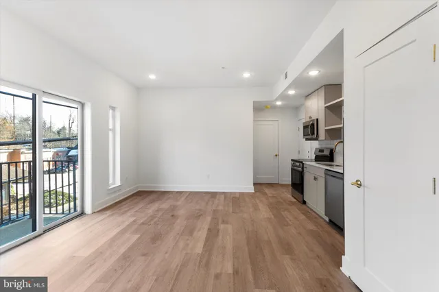 a view of a kitchen with a sink and a window