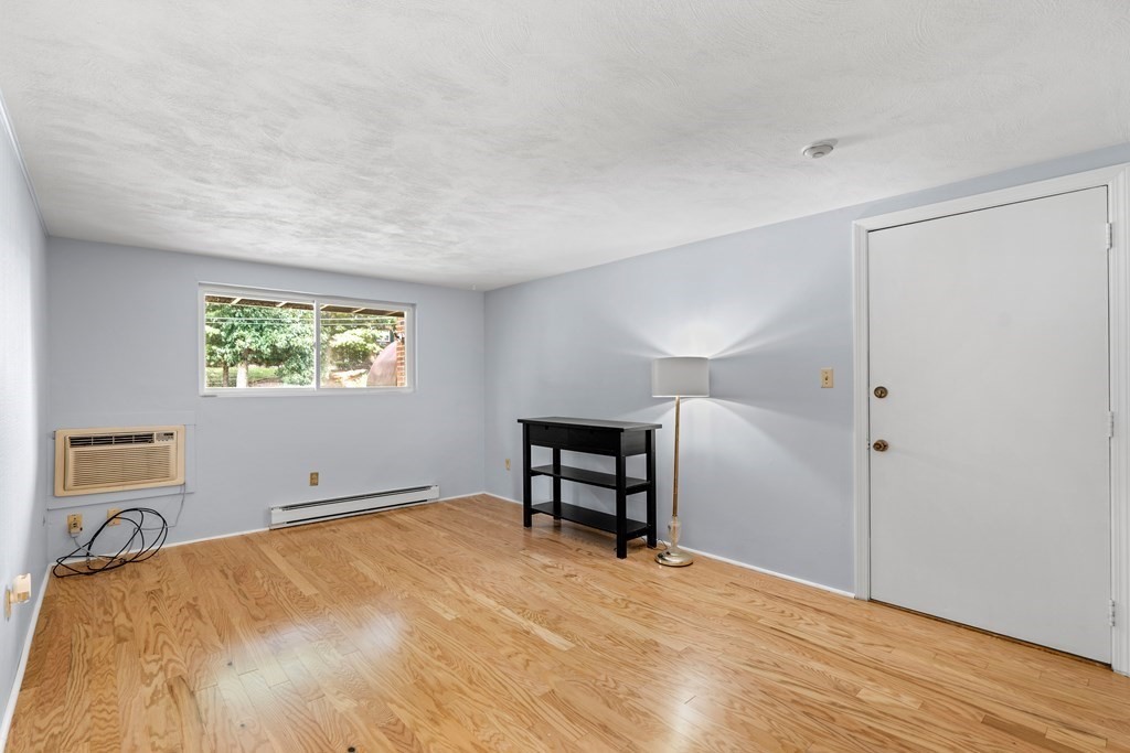7 Wampus Avenue, Unit 15 Acton, MA 01720 - Photo 2 of 30 a view of a livingroom with a workspace