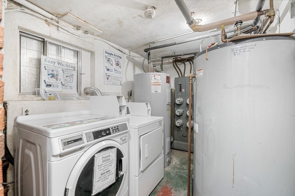 7 Wampus Avenue, Unit 15 Acton, MA 01720 - Photo 23 of 30 a utility room with dryer and washer