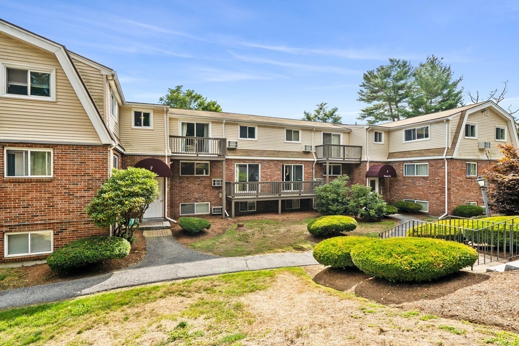 7 Wampus Avenue, Unit 15 Acton, MA 01720 - Photo 24 of 30 a view of a house with backyard and sitting area