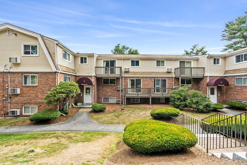 7 Wampus Avenue, Unit 15 Acton, MA 01720 - Photo 25 of 30 a front view of a house with a yard