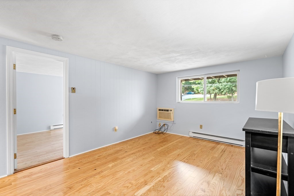 7 Wampus Avenue, Unit 15 Acton, MA 01720 - Photo 3 of 30 a room with a bed and a window