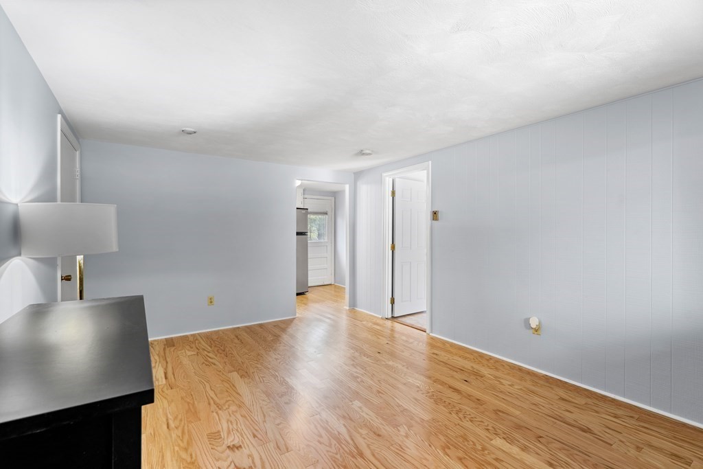 7 Wampus Avenue, Unit 15 Acton, MA 01720 - Photo 4 of 30 a view of a livingroom with wooden floor