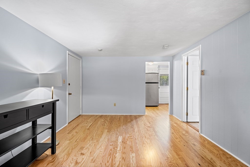 7 Wampus Avenue, Unit 15 Acton, MA 01720 - Photo 6 of 30 a view of a room with wooden floor and a sink