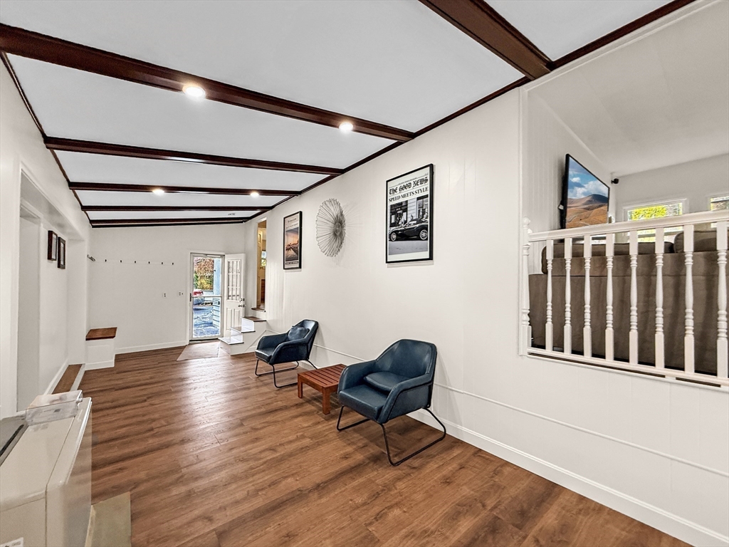 126 Beach Road Salisbury, MA 01952 - Photo 25 of 30 a living room with couches chairs and wooden floor