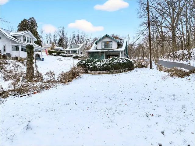 a bathroom with a sink mirror and shower