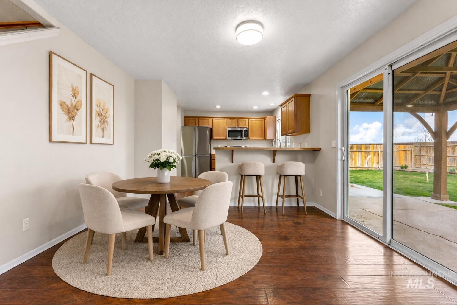 2503 Carnegie Street Caldwell, ID 83607 - Photo 5 of 20 Dining space featuring recessed lighting and dark wood finished floors