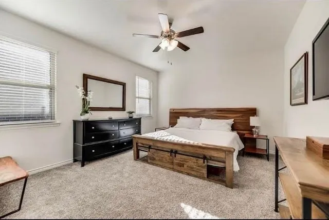 a bedroom with a bed furniture and a window