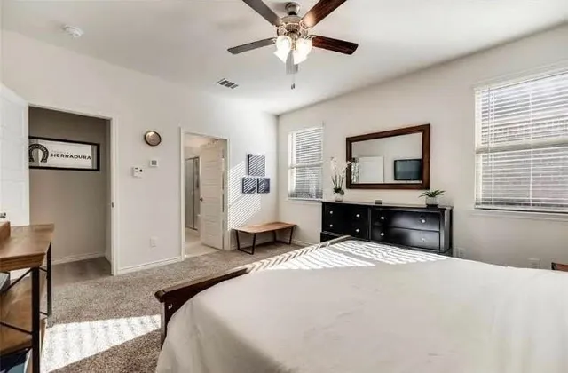 a bedroom with a bed and a tv