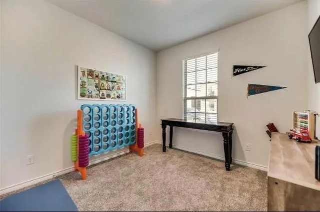 a view of workspace with furniture and window