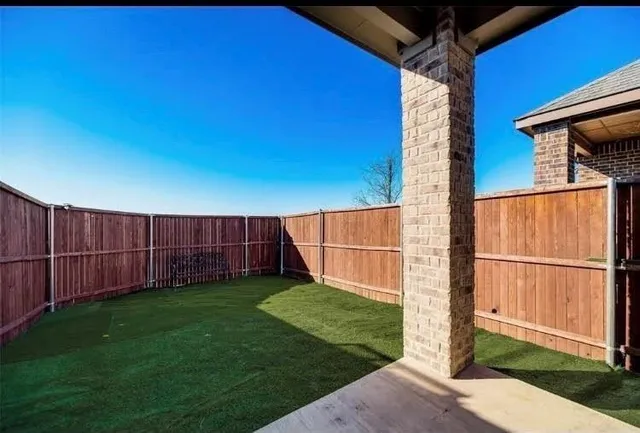 a view of a backyard with parked area