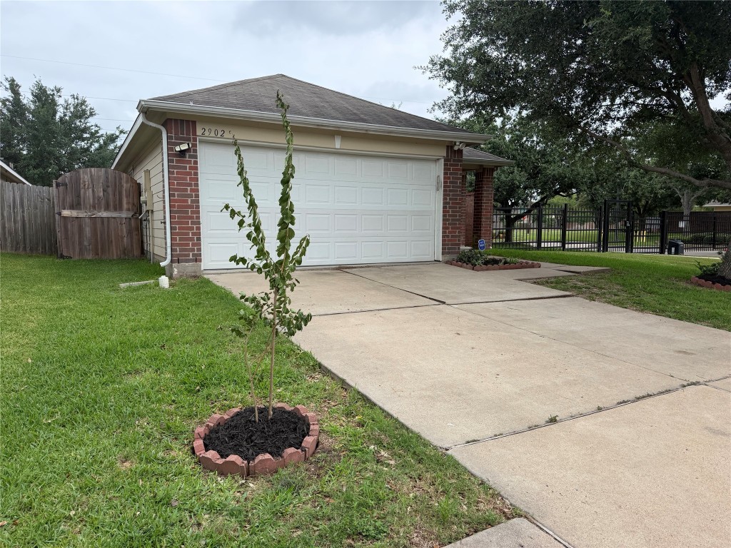 2902 Back Bay Brook Trail Houston, TX 77045 - Photo 2 of 11 a front view of house with a yard