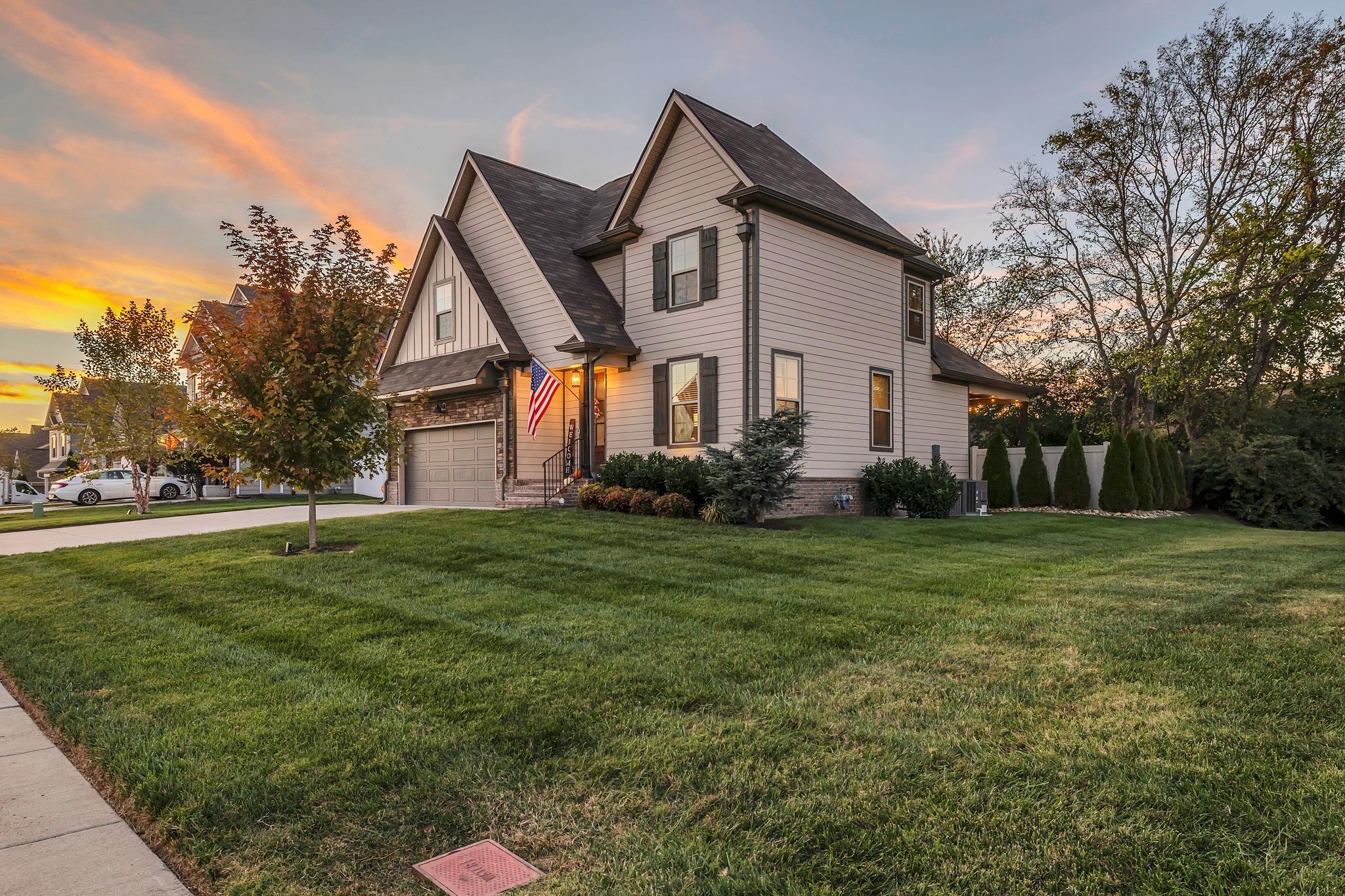 a front view of house with yard and green space