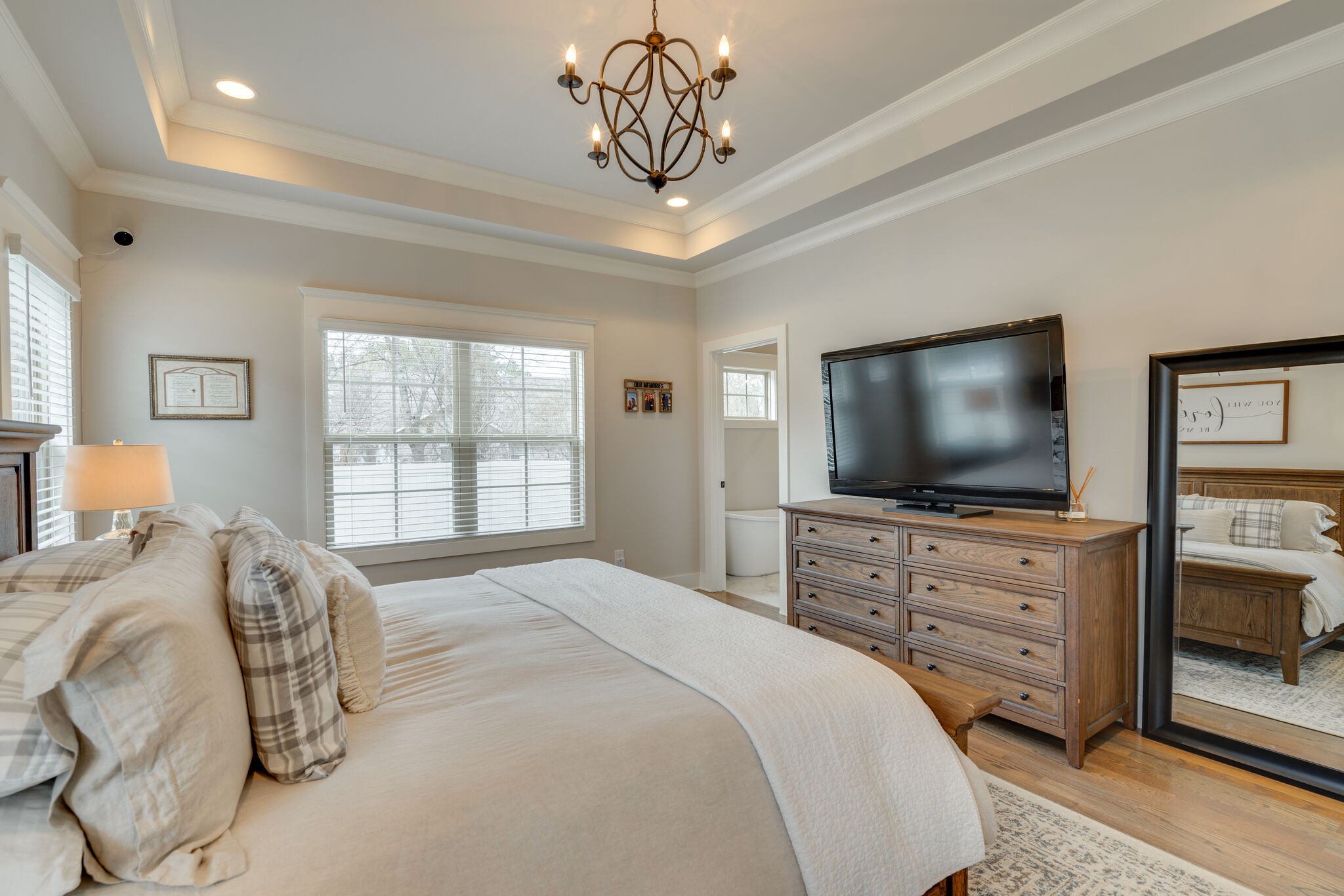 987 Carnation Drive Spring Hill, TN 37174 - Photo 11 of 26 a bedroom with a bed and a flat screen tv on dresser