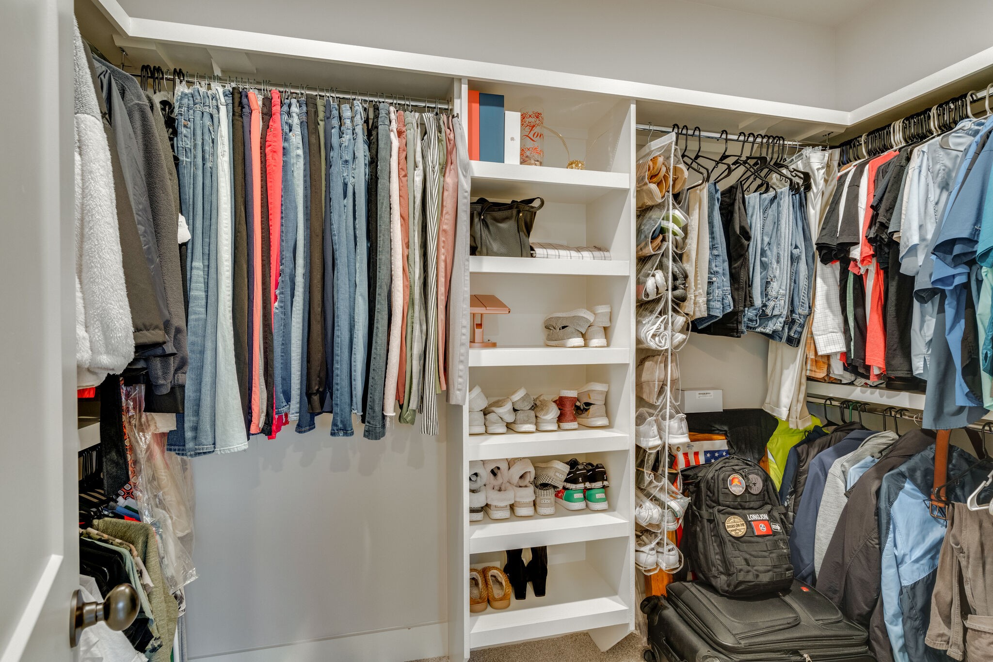987 Carnation Drive Spring Hill, TN 37174 - Photo 13 of 26 a view of walk in closet with clothes and shoes