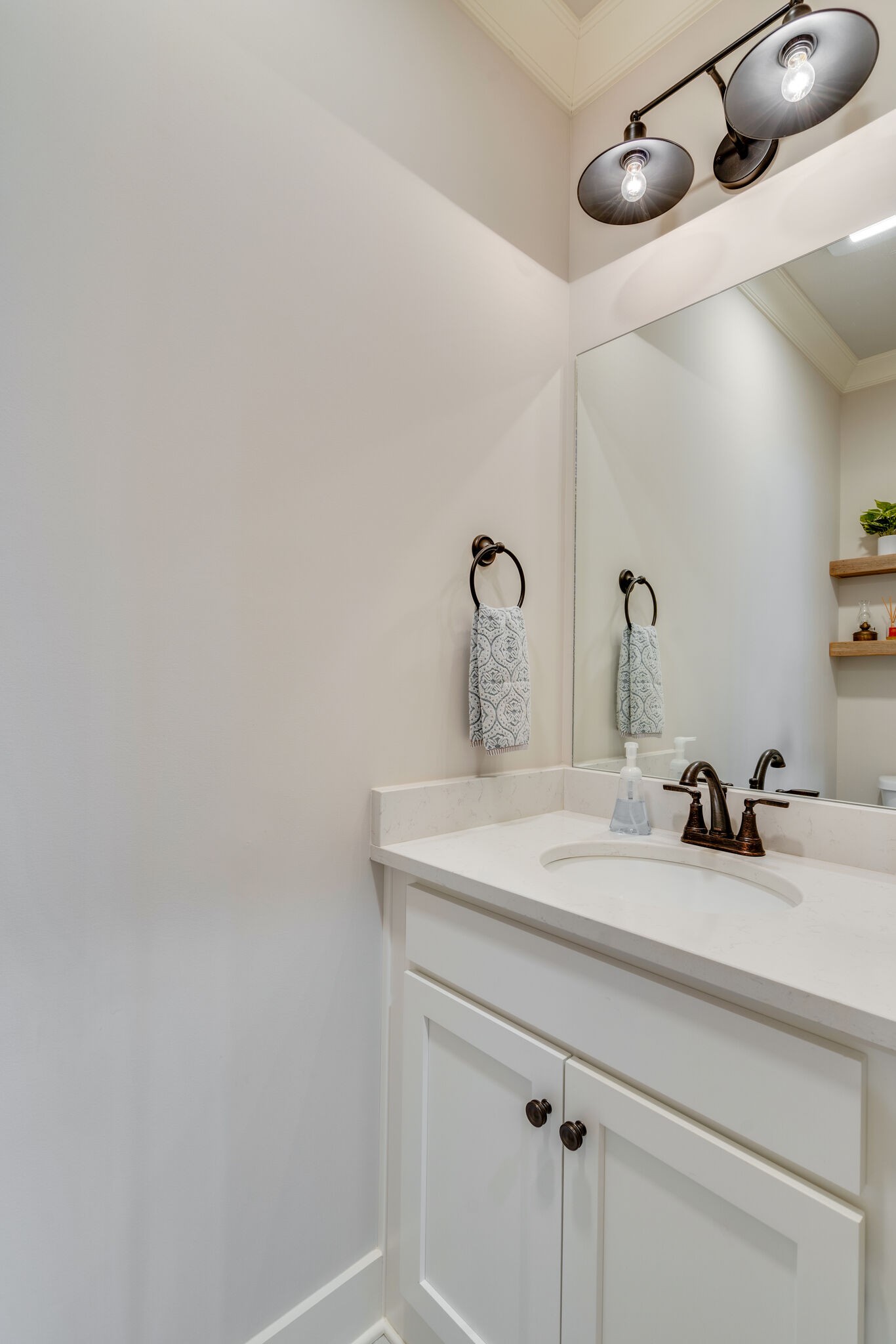 987 Carnation Drive Spring Hill, TN 37174 - Photo 15 of 26 a bathroom with a sink and a mirror